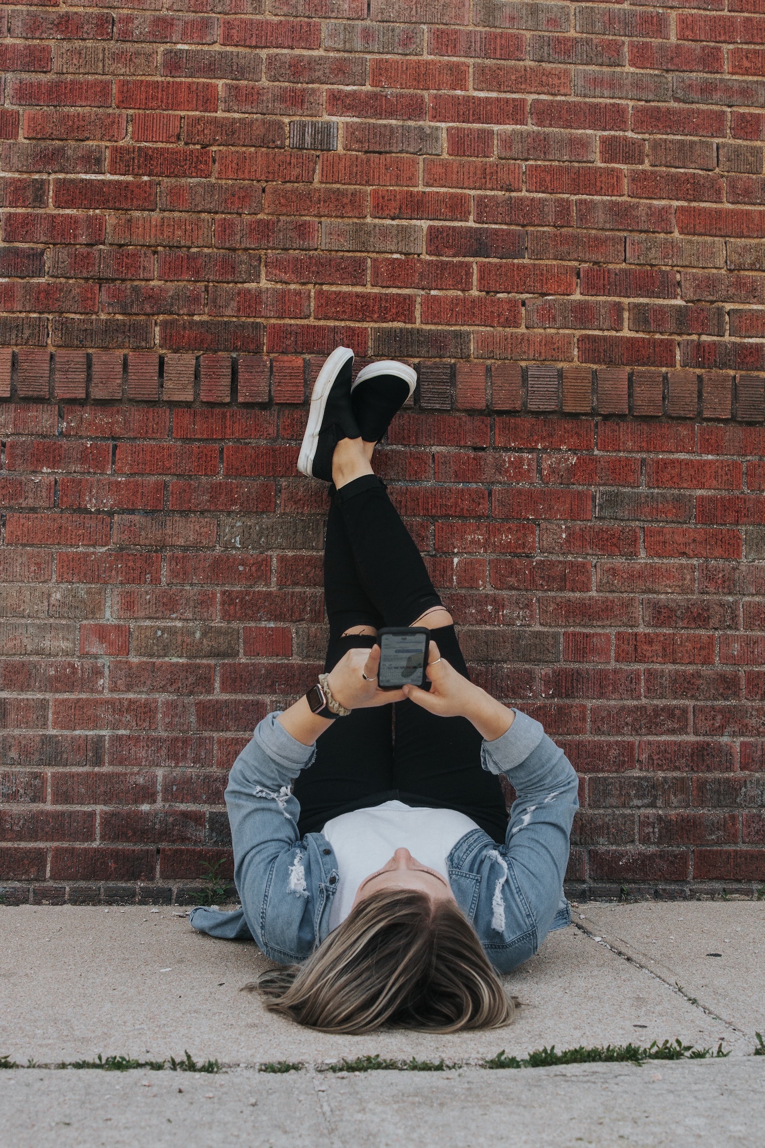 Girl enjoying a list created using FlashList on a phone